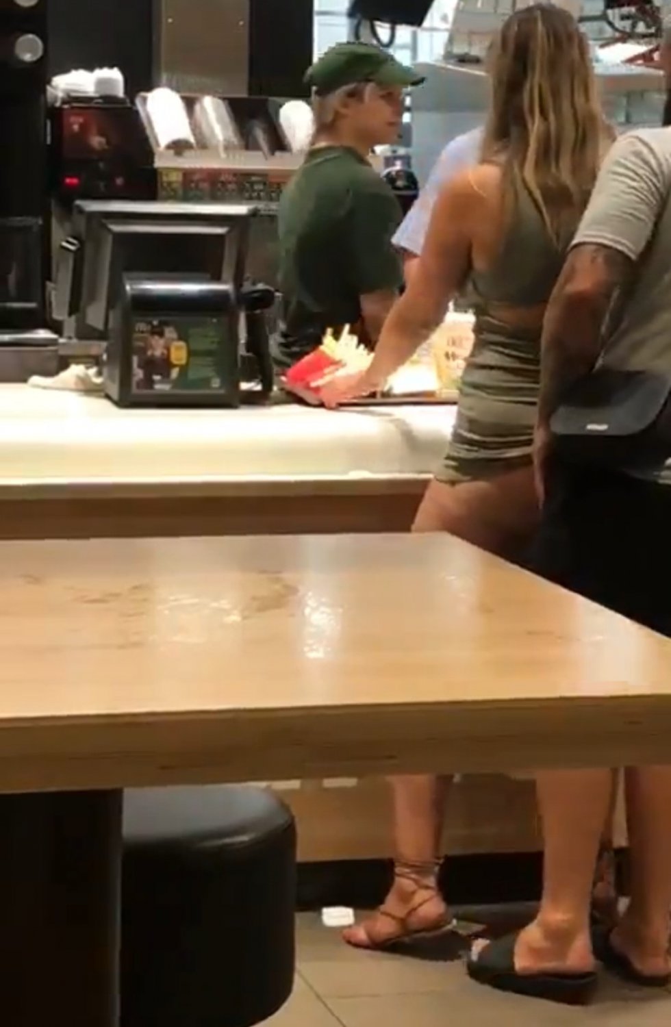 At McDonalds counter, she ordered a HugeMac with extra salami and creamy sauce #R1vsOlfV